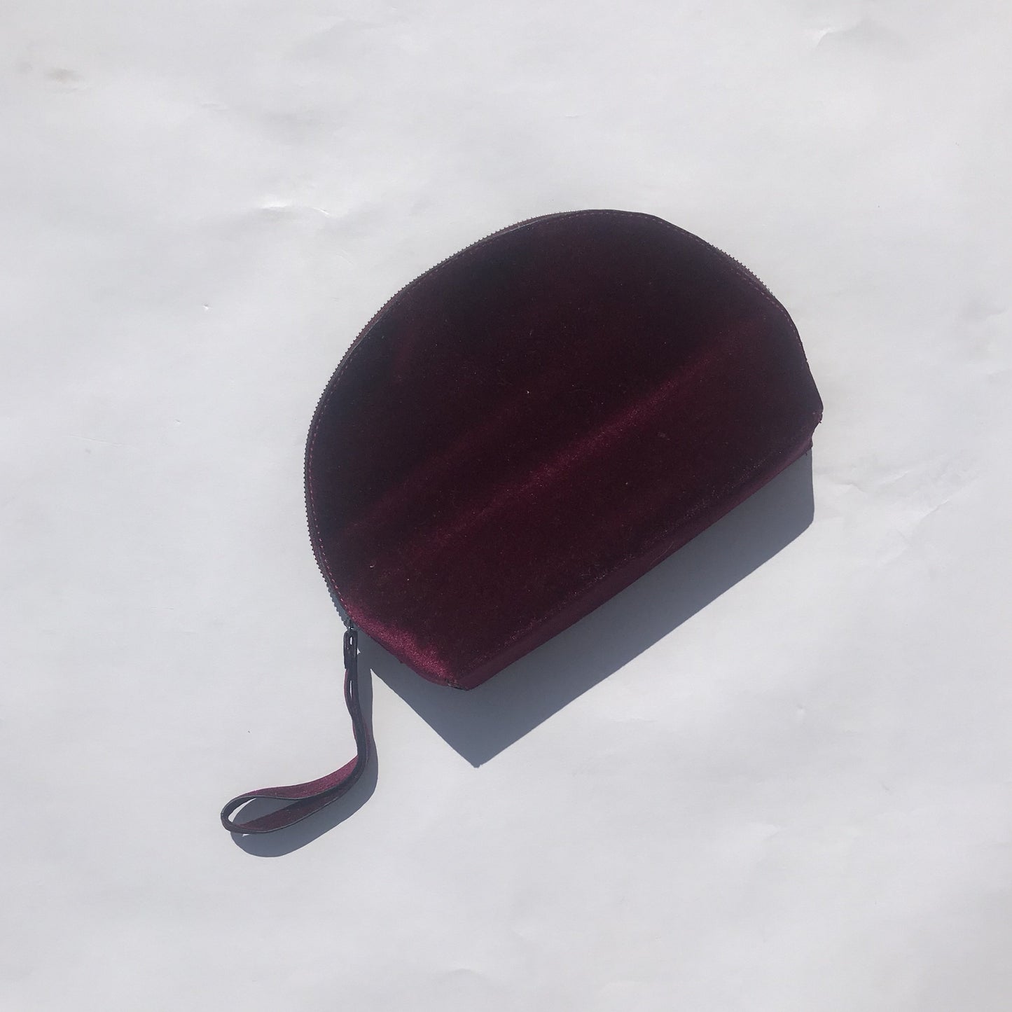 Burgundy velvet clutch bag